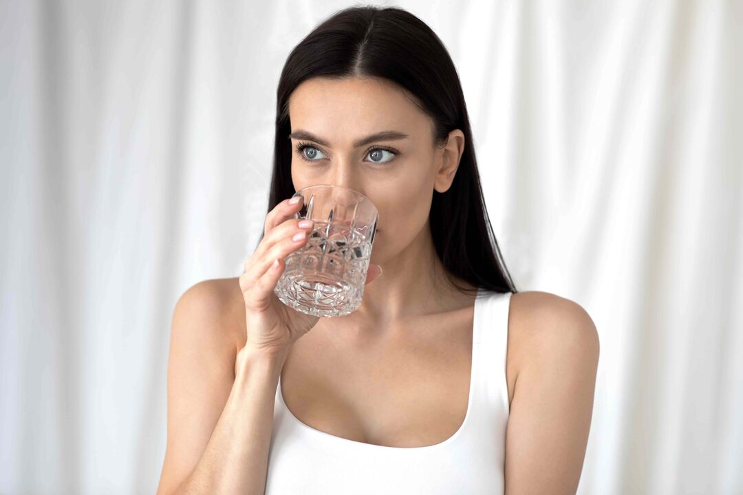 girl drinks water for weight loss on proper nutrition